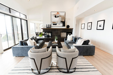 Down to Earth Projects | Salt Lake Residence - living area designed with two sofas two chairs and a fireplace 