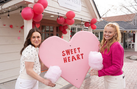 Girls Enjoying Galentines at Gardner Village - two girls holding a heart at gardner village 
