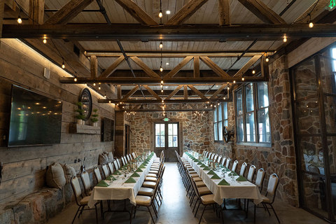 The Wheel Room located in Archibald's Restaurant - wheel room set up with long banquet tables 