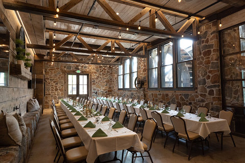 The Wheel Room located in Archibald's Restaurant  - wheel room set up with long banquet tables 