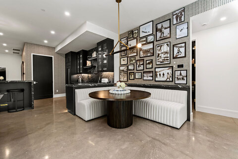 Down to Earth Projects | Park City Parade with Riverwood Interiors - memorabilia wall with vintage photos in park city modern home 