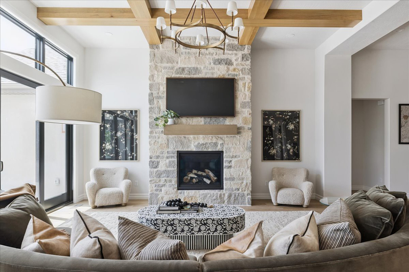 Down to Earth Projects<br>Symphony Homes Parade Ninth + North Design - Down to Earth Projects<br>Symphony Homes Parade Ninth + North Design - curved sofa in large family room with coffee table