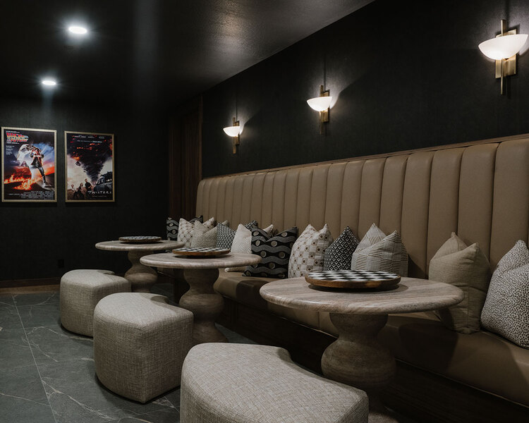 Down to Earth Projects | Utah Valley Parade at The Legacy at Meadow Ridge - Down to Earth Projects | Utah Valley Parade at The Legacy at Meadow Ridge - home theater with tables and bench seating