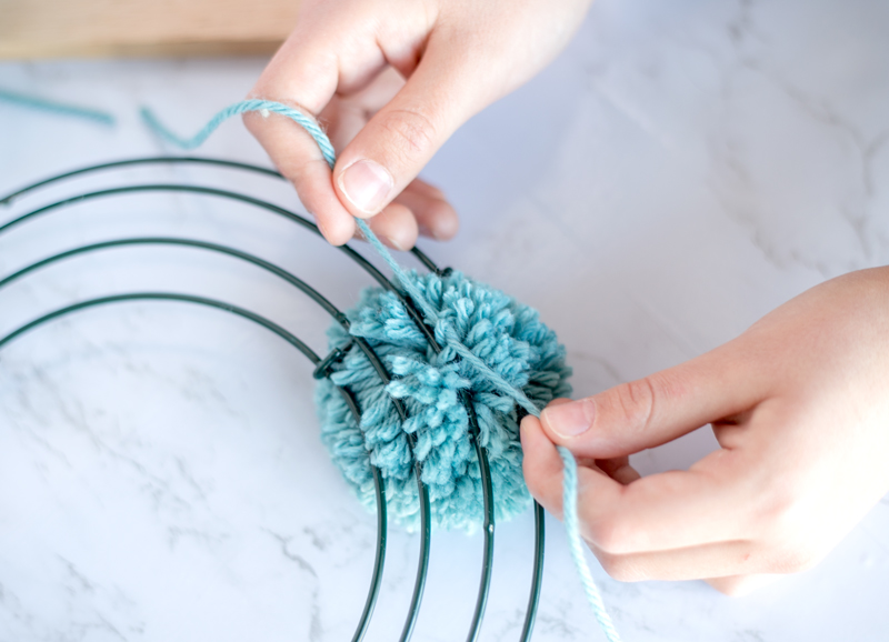 how to make a pom pom wreath